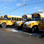 school buses with snow